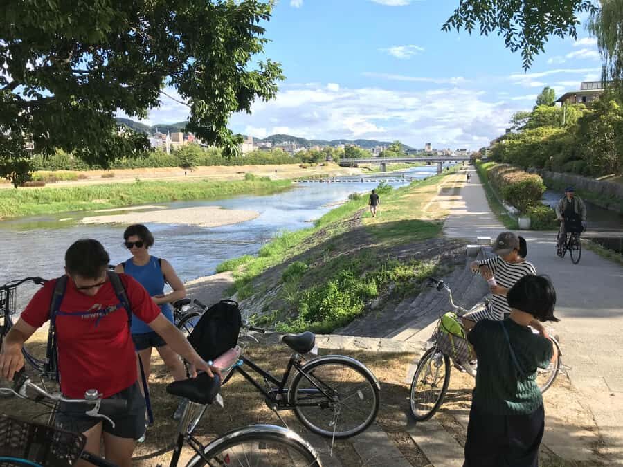Cycle Kyoto's Hidden Gems & Gion Stroll - The river junction and the lit-up return: when the bike ride turns magical