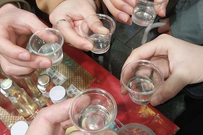 Kyoto Food Tour of 10 Tastings with Wagyu, Mochi & More Surprises - Nishiki Market: a 400m walk of artisans, sake, yuba tofu, and fishcake flavors